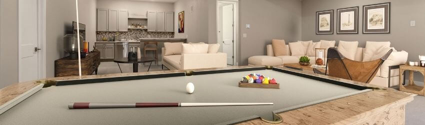 Pool table in modern living room, kitchen in background.