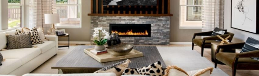 Modern living room with fireplace and comfortable seating.