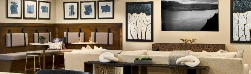 Modern living room with contemporary artwork and cozy seating.