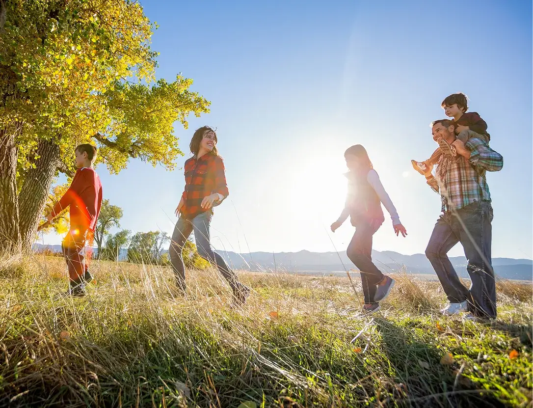 Family enjoying a walk along scenic trails at the Solstice community