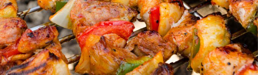 Grilled kebabs with meat and vegetables on skewers.