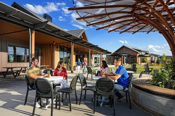 Residents gathering at the Solstice High Line House outdoor patio and community clubhouse