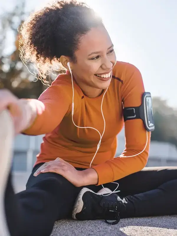 Resident stretching outdoors while enjoying an active and healthy community lifestyle