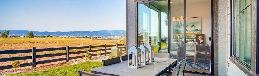 Outdoor patio set with mountain view in the background.